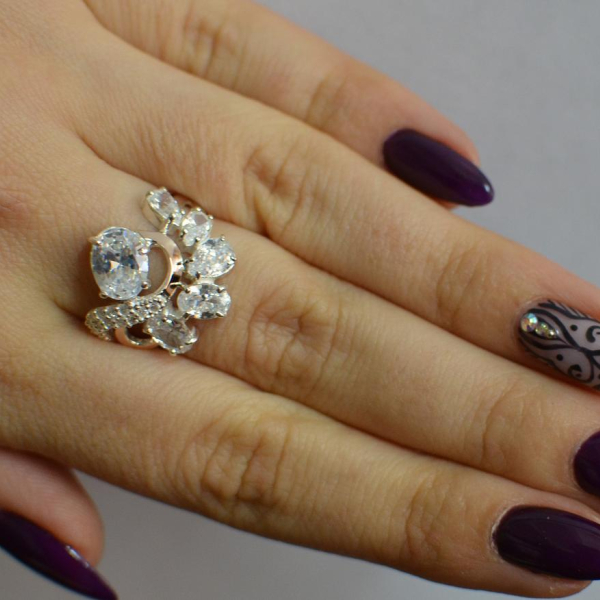 Срібна каблучка з золотими вставками