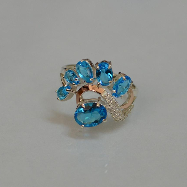 Срібна каблучка з золотими вставками