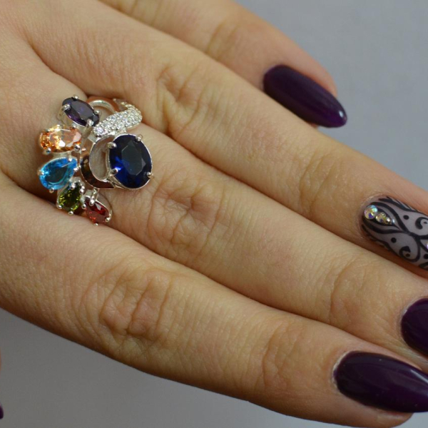 Срібна каблучка з золотими вставками