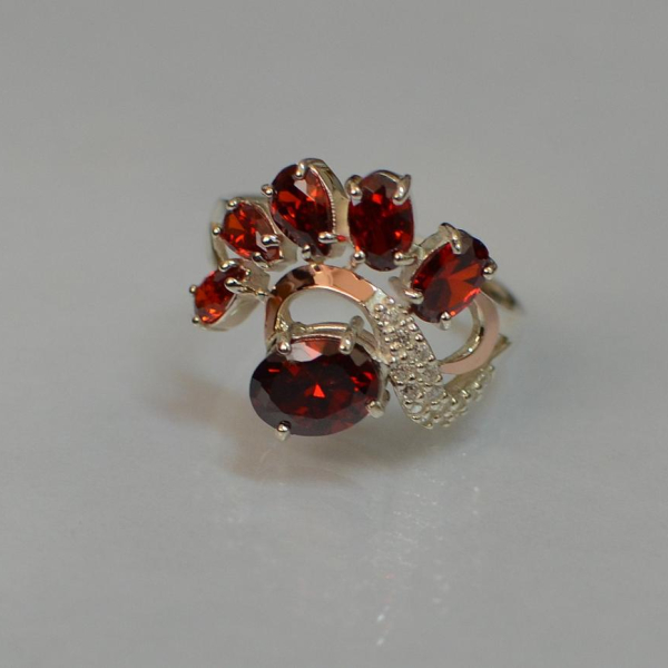 Срібна каблучка з золотими вставками