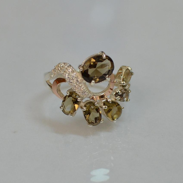 Срібна каблучка з золотими вставками