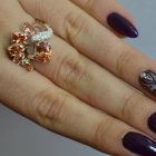 Срібна каблучка з золотими вставками