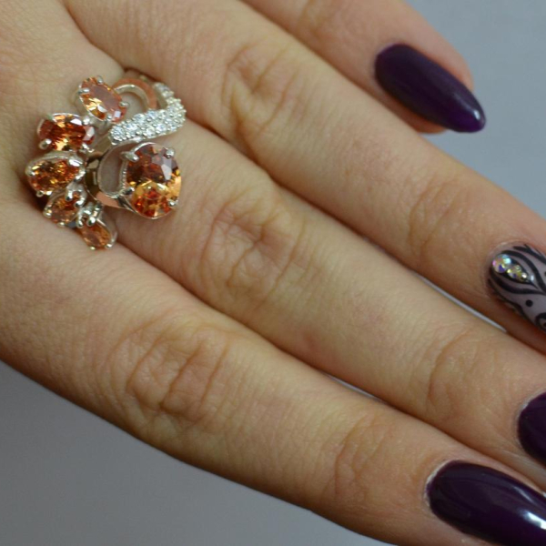 Срібна каблучка з золотими вставками