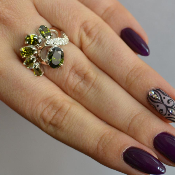 Срібна каблучка з золотими вставками