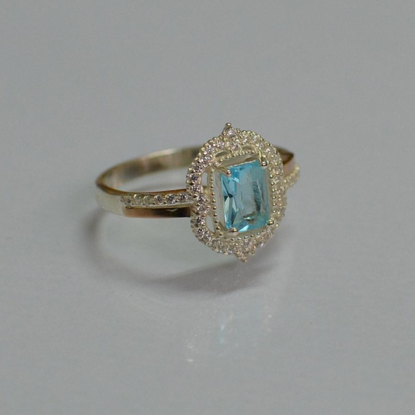 Срібна каблучка з золотими вставками