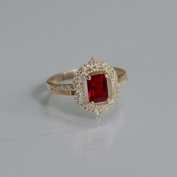 Срібна каблучка з золотими вставками