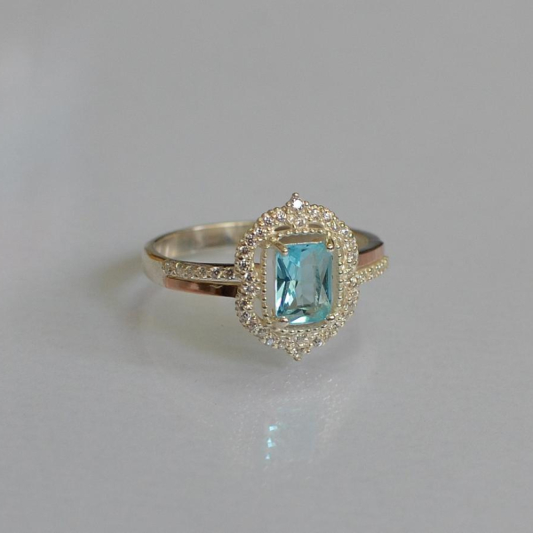 Срібна каблучка з золотими вставками