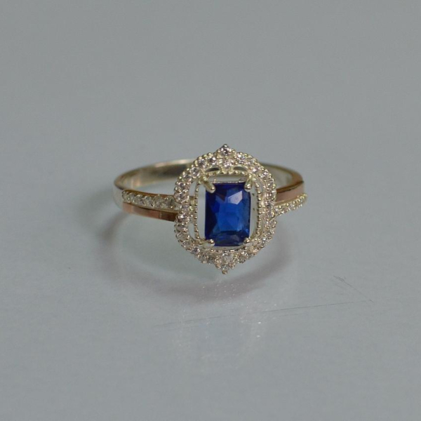 Срібна каблучка з золотими вставками