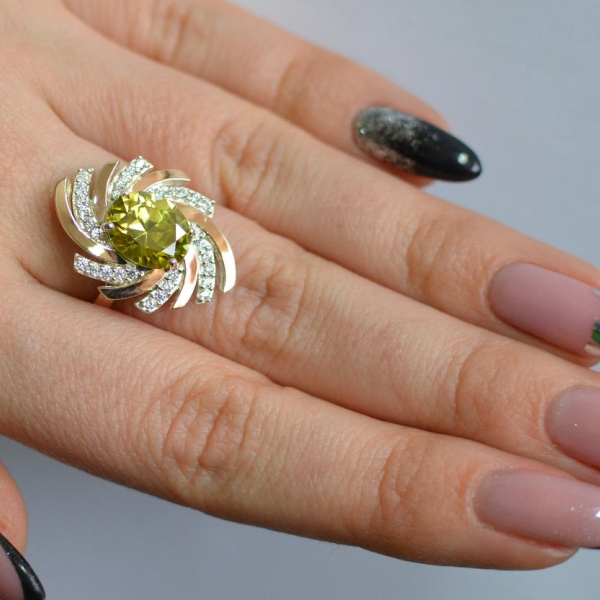 Срібна каблучка з золотими вставками