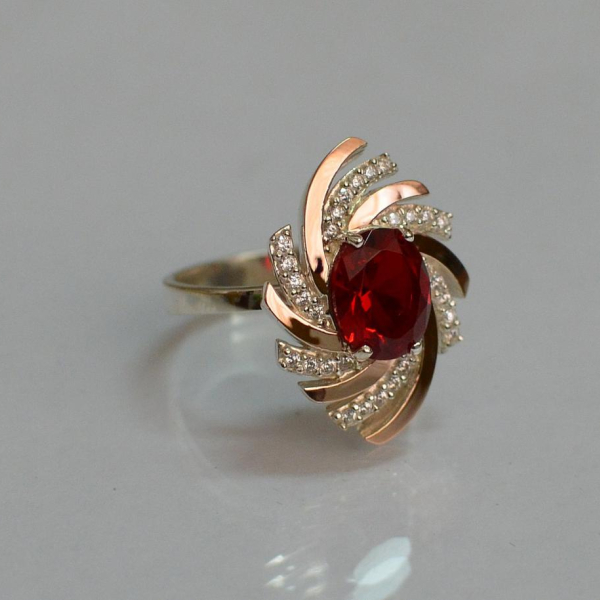 Срібна каблучка з золотими вставками