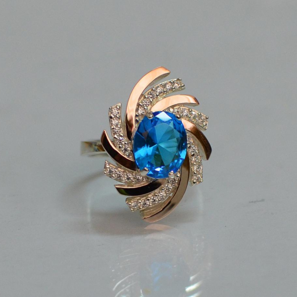 Срібна каблучка з золотими вставками