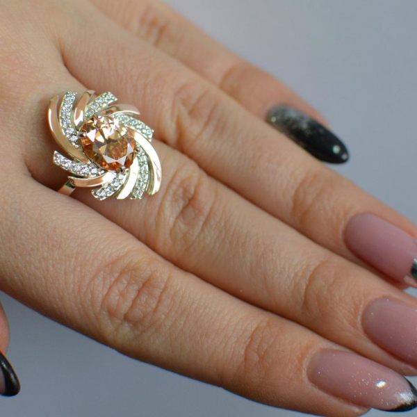 Срібна каблучка з золотими вставками