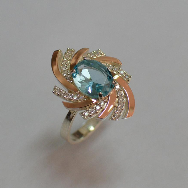 Срібна каблучка з золотими вставками