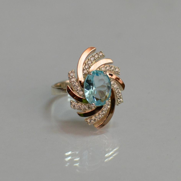 Срібна каблучка з золотими вставками