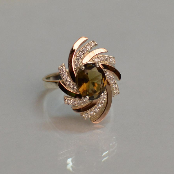 Срібна каблучка з золотими вставками