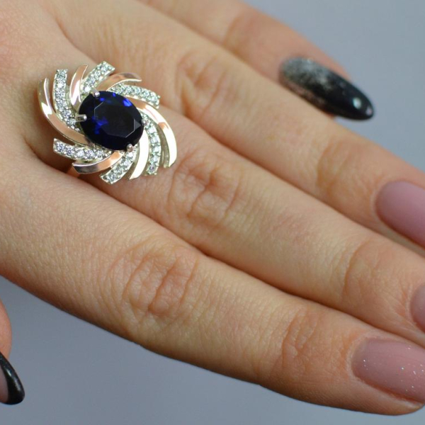 Срібна каблучка з золотими вставками