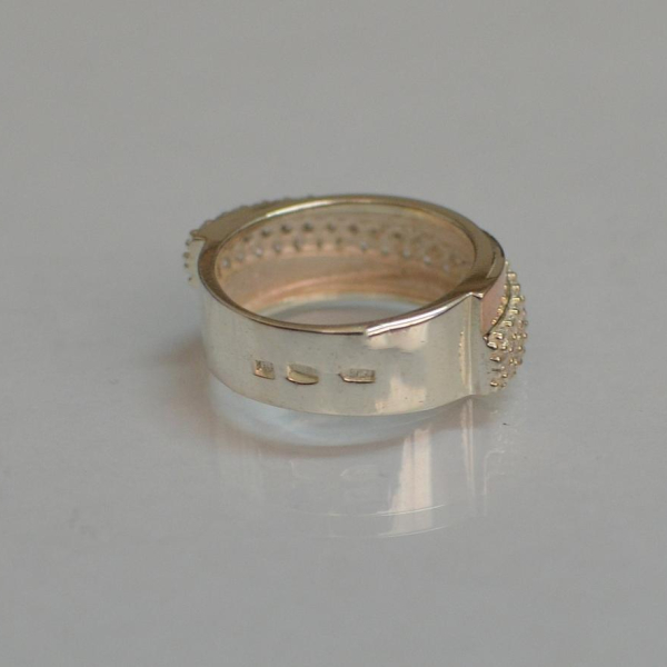 Срібна каблучка з золотими вставками