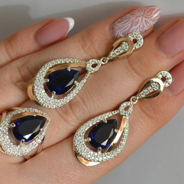 Срібний набір з золотими пластинами