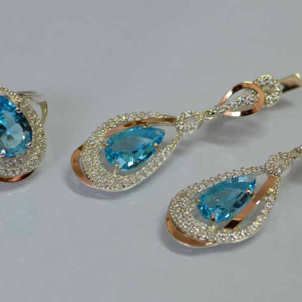 Срібний набір з золотими пластинами