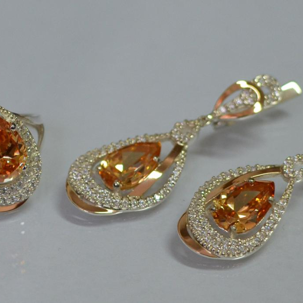 Срібний набір з золотими пластинами