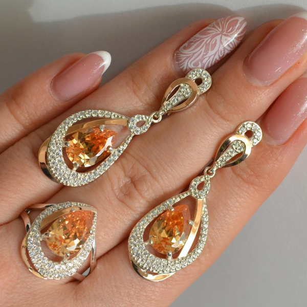 Срібний набір з золотими пластинами