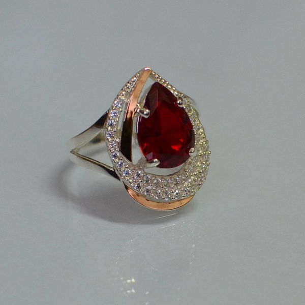 Срібна каблучка з золотими вставками