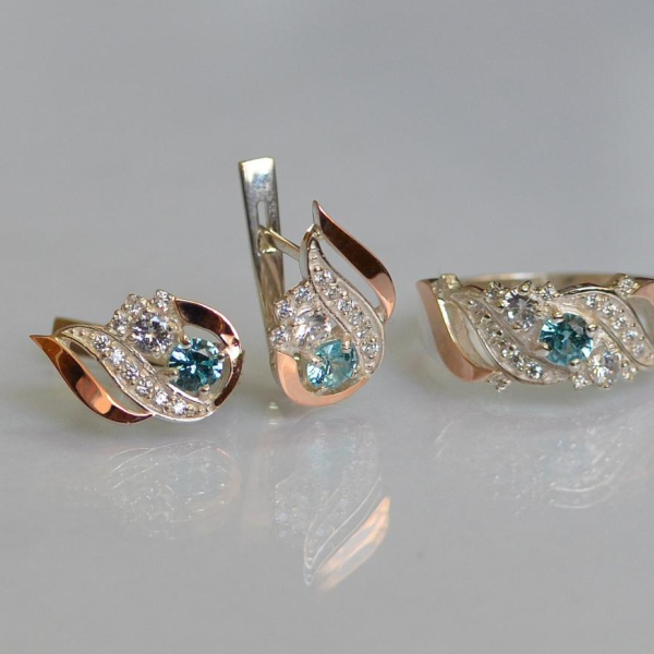 Срібний набір з золотими пластинами