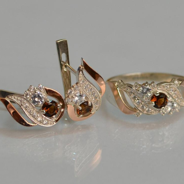 Срібний набір з золотими пластинами