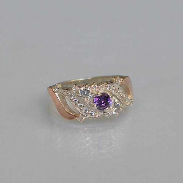 Срібна каблучка з золотими вставками