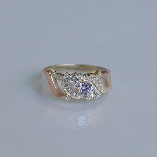 Срібна каблучка з золотими вставками