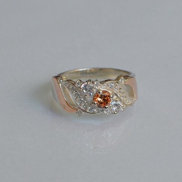 Срібна каблучка з золотими вставками