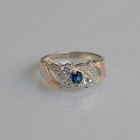 Срібна каблучка з золотими вставками