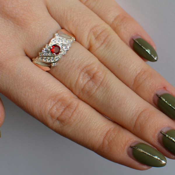 Срібна каблучка з золотими вставками