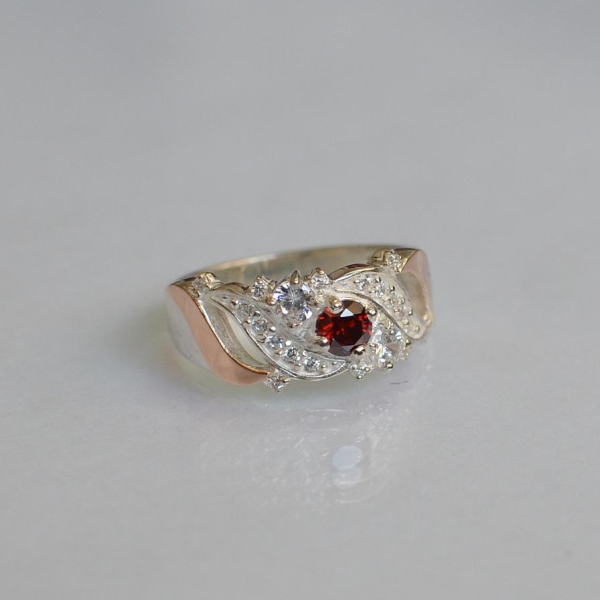 Срібна каблучка з золотими вставками