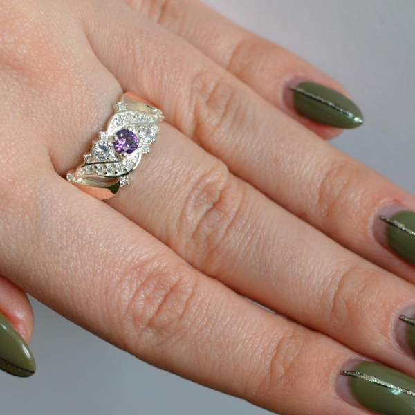 Срібна каблучка з золотими вставками