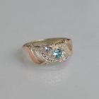 Срібна каблучка з золотими вставками