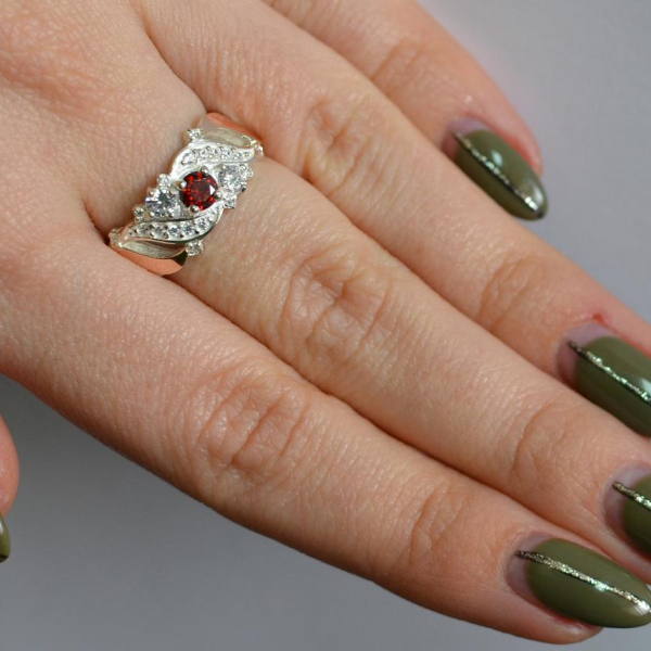 Срібна каблучка з золотими вставками