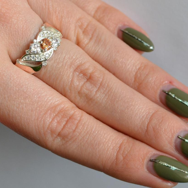 Срібна каблучка з золотими вставками