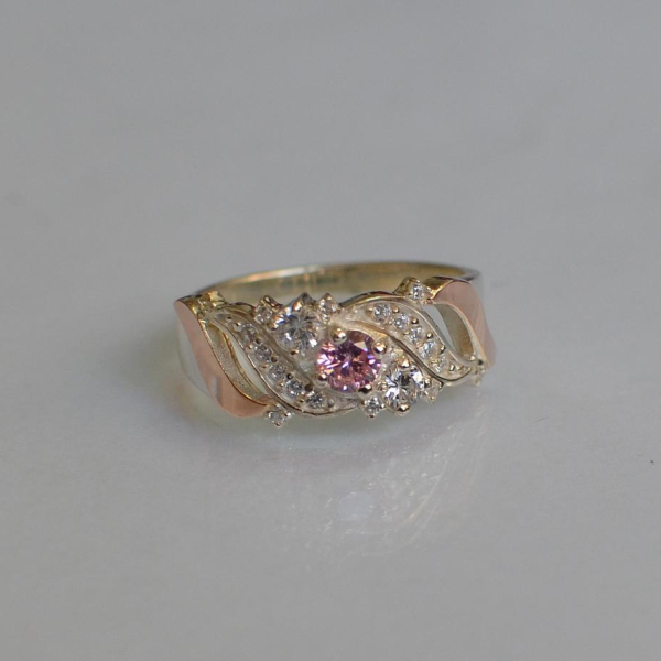 Срібна каблучка з золотими вставками