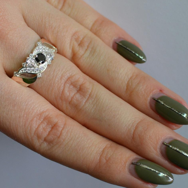 Срібна каблучка з золотими вставками