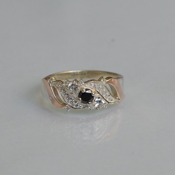 Срібна каблучка з золотими вставками