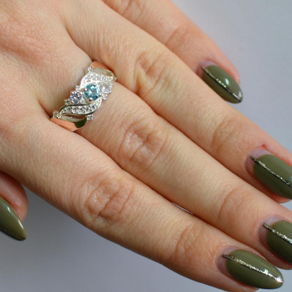 Срібна каблучка з золотими вставками