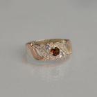 Срібна каблучка з золотими вставками