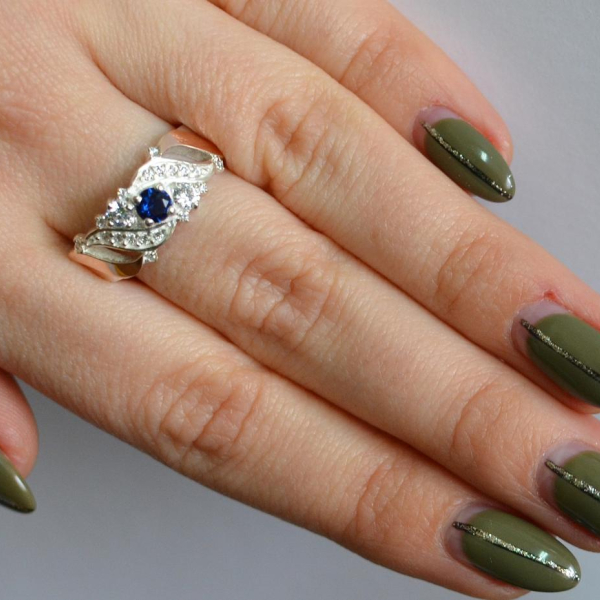 Срібна каблучка з золотими вставками