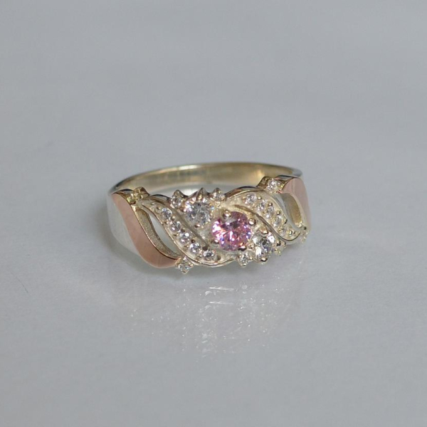 Срібна каблучка з золотими вставками