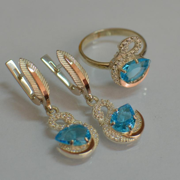 Срібний набір з золотими пластинами