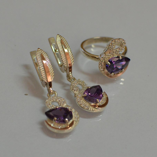 Срібний набір з золотими пластинами