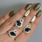 Срібний набір з золотими пластинами