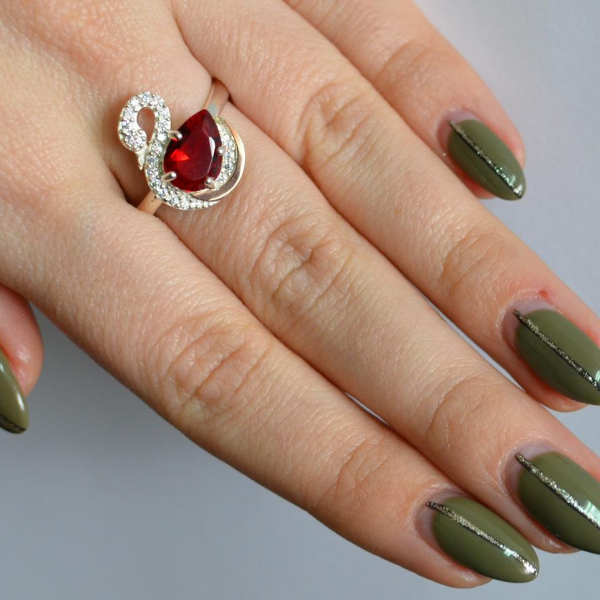 Срібна каблучка з золотими вставками