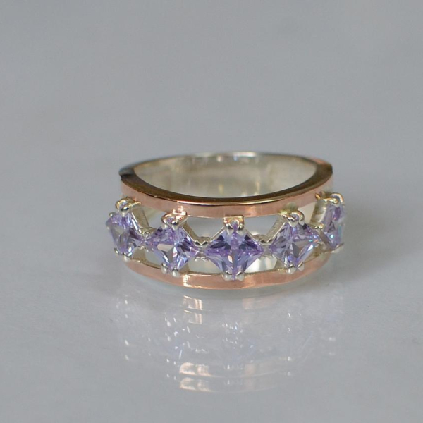 Срібна каблучка з золотими вставками